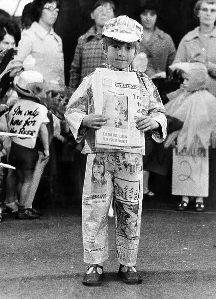 Five year old Sean, wearing a suit made of Evening Chronicle newspapers