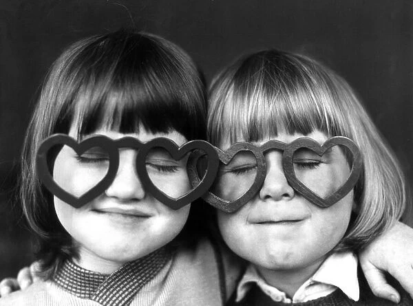Four year old Sheldon Neal (right) and Terry Green, wearing love heart shaped glasses at