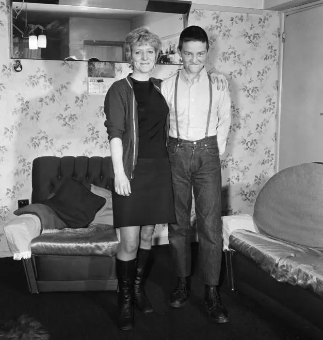 Framed Print : Fifteen year old skinhead Chris Harward poses at home with his mother Joan at their flat Framed Print : Fifteen year old skinhead Chris Harward poses at home with his mother Joan at their flat