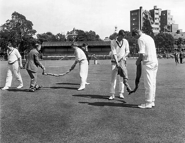 Yorkshire County Cricket players drying out the pitch. 5th August 1966