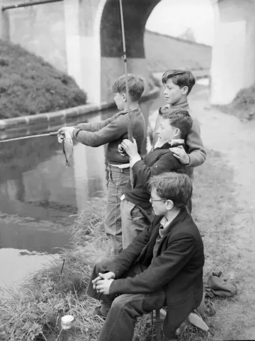 Framed Print : Four young anglers fish at the canal for perch. They are Peter Bethell