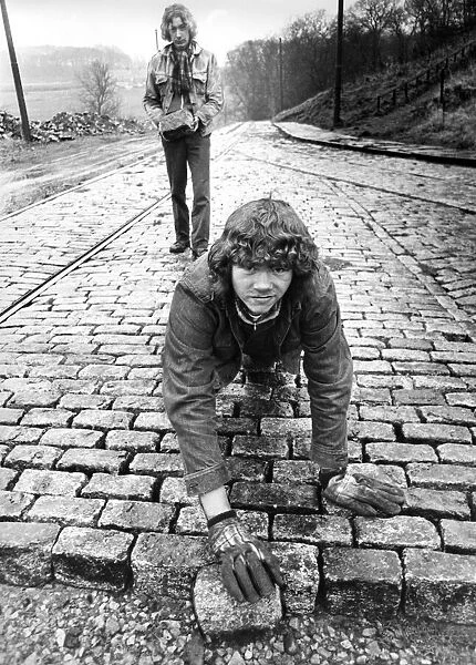 These young apprentices help lay the cobblestones in between the tram lines at Beamish