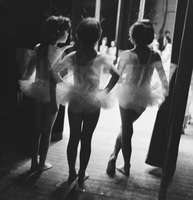 Framed Print : Three young ballerinas look on at the performance of Sleeping Beauty from the wings of Framed Print : Three young ballerinas look on at the performance of Sleeping Beauty from the wings of