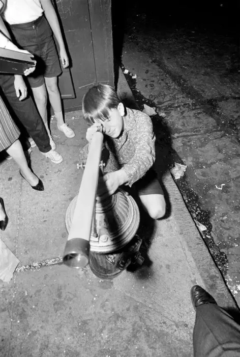 Framed Print : A young Beatles fan tries to get a closer view of his idols on the streets of New York Framed Print : A young Beatles fan tries to get a closer view of his idols on the streets of New York