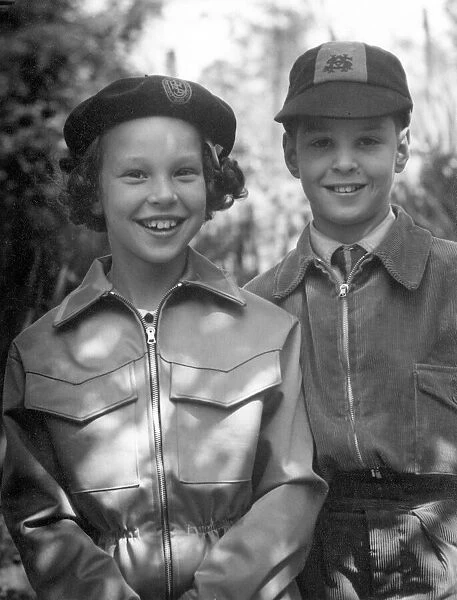 Young boy and girl together, both wearing hats Circa 1945 P044432