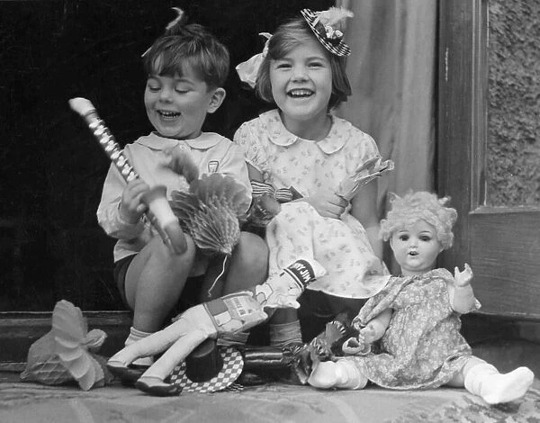 Young boy and girl with toys. c. 1945 P044472