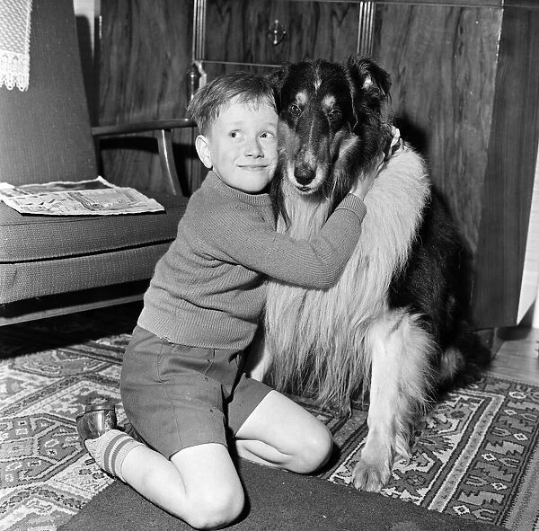 A young boy with his pet dog. 5th December 1961