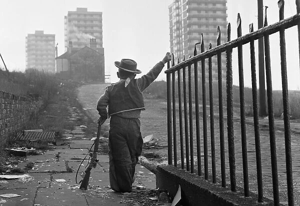 Young boy playing cowboys in Collyhurst, Manchester 14th January 1968 His