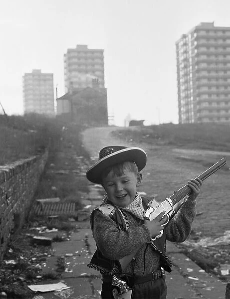 Young boy playing cowboys in Collyhurst, Manchester 14th January 1968 His