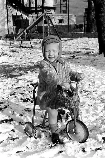 Young boy Robert playing on his bicycle in the snow. November 1969 Z11486