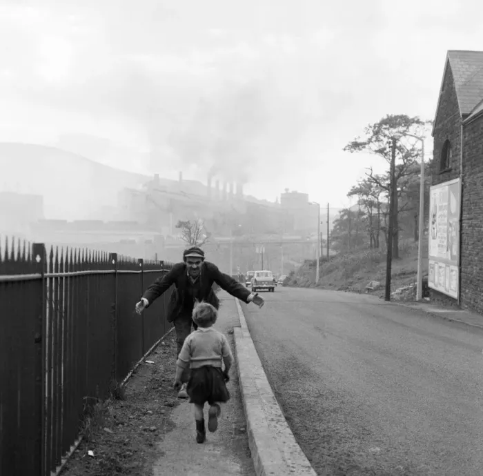 Framed Print : A young boy running into the arms of a man. Ebbw Vale, Blaenau Gwent, Wales Framed Print : A young boy running into the arms of a man. Ebbw Vale, Blaenau Gwent, Wales