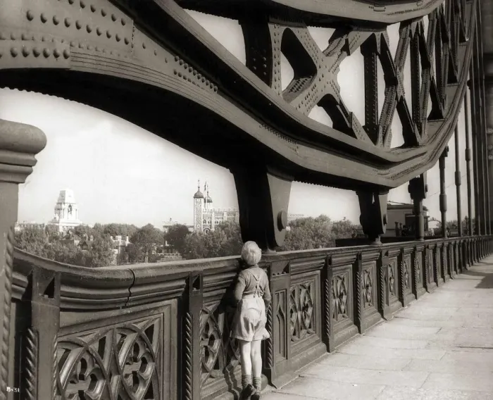 Framed Print : A young boy on tip toes to get a view from the bridge - 1959 Framed Print : A young boy on tip toes to get a view from the bridge - 1959