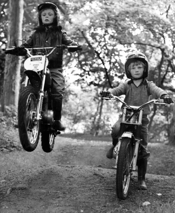 Framed Print : Two young boys Paul and Jason Wilson ride on their motorbikes on a woodland track Framed Print : Two young boys Paul and Jason Wilson ride on their motorbikes on a woodland track