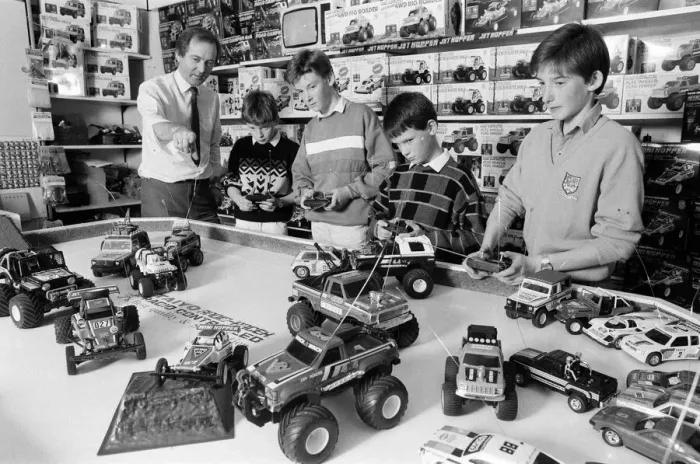 Framed Print : Young boys playing with toy remote control cars in Hamley s, London Framed Print : Young boys playing with toy remote control cars in Hamley s, London