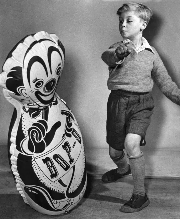 Framed Print : Young child with a large inflated balloon, bought from the seaside Circa 1955