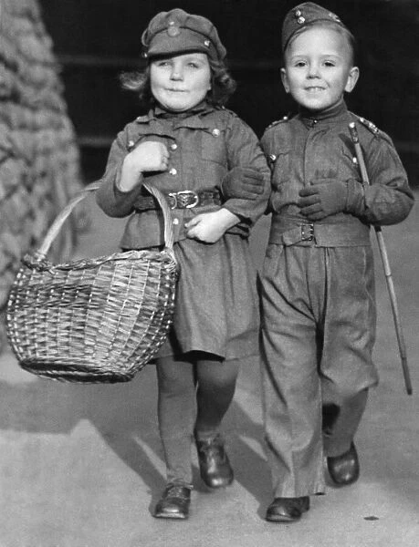 Young children Bev Ransome and Joan Green dressed in military uniform. January 1940