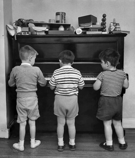 Young children play the piano 18th July 1960. Local Caption Children: Handicapped