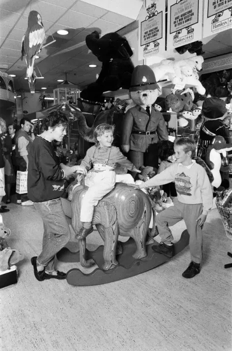 Framed Print : Young children playing with toys in Hamley s, London. 21st October 1986 Framed Print : Young children playing with toys in Hamley s, London. 21st October 1986