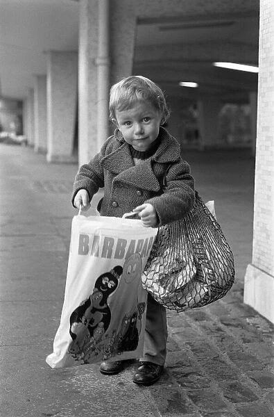 A Young Christmas shopper in Birmingham. 20th December 1975