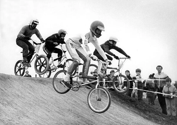 Young contestants over the obstacle in a BMX race at Windy Nook
