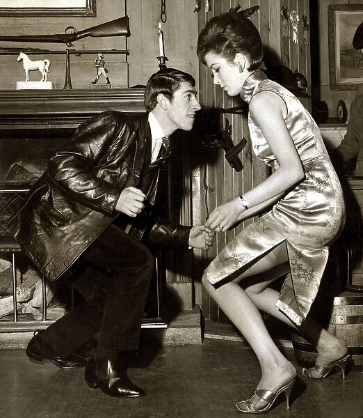 A young couple dancing the twist in their living room May 1963