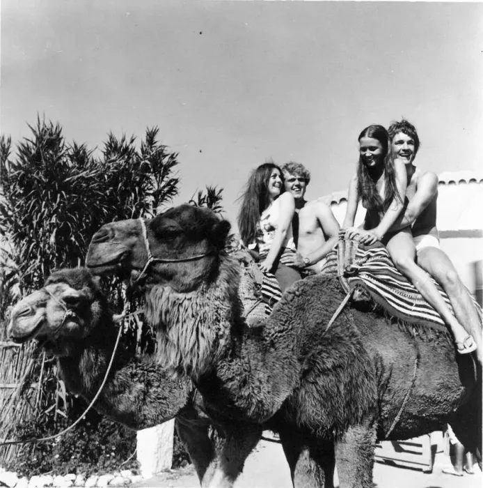 Framed Print : These young couple are enjoying a camel trek at Camp Africa Framed Print : These young couple are enjoying a camel trek at Camp Africa