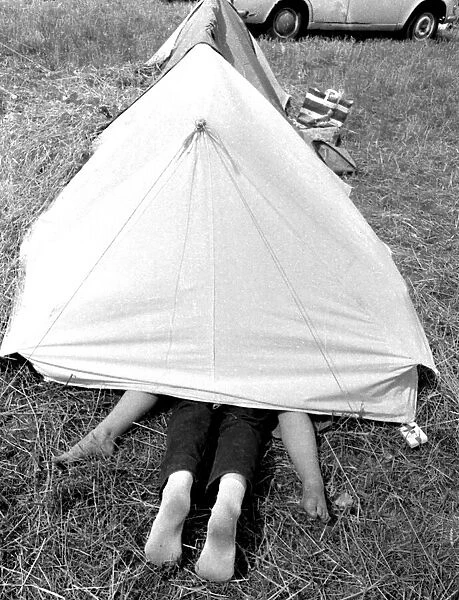 Young couple making love inside their tent at the Isle of Wight Pop Festival 30th