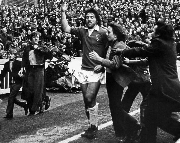Young Everton fans applaud their new hero Bob Latchford at Goodison Park after