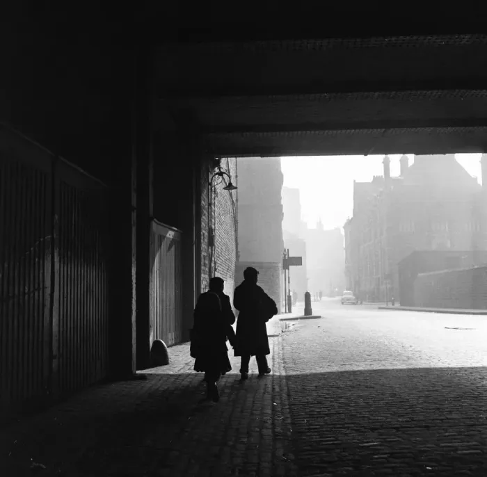 Framed Print : A young family walks home with their purchases from the flea market at Club Row