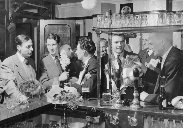 Framed Print : Young Fathers in the Pub June 1954 New fathers with their bouquets of flowers have Framed Print : Young Fathers in the Pub June 1954 New fathers with their bouquets of flowers have