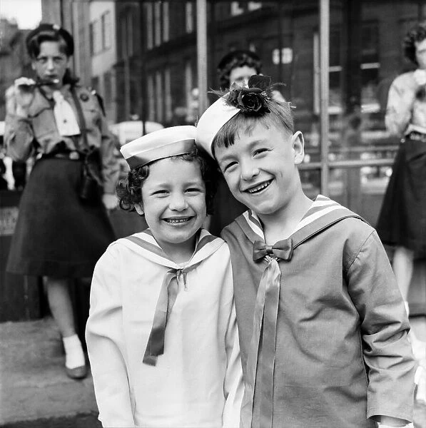 Two young friends taking part n the Manchester Whit Walks. June 1960 M4383-024