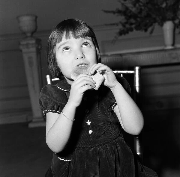 A young girl, Candy Paterson, eating her crusts. 4th February 1954