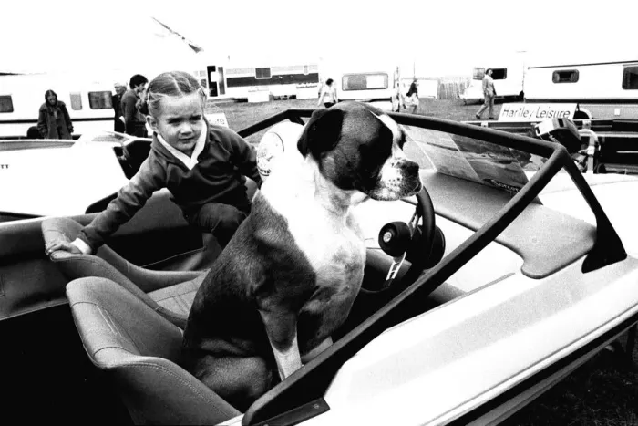 Framed Print : A young girl and her dog try out a speedboat at the Whitley Bay Motor Show. 18 / 07 / 80 Framed Print : A young girl and her dog try out a speedboat at the Whitley Bay Motor Show. 18 / 07 / 80