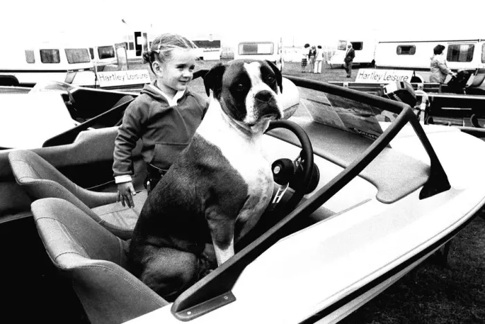 Framed Print : A young girl and her dog try out a speedboat at the Whitley Bay Motor Show. 18 / 07 / 80 Framed Print : A young girl and her dog try out a speedboat at the Whitley Bay Motor Show. 18 / 07 / 80