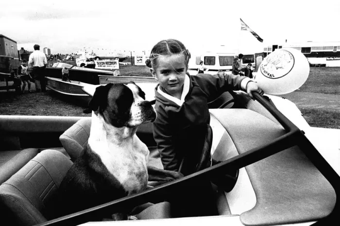 Framed Print : A young girl and her dog try out a speedboat at the Whitley Bay Motor Show. 18 / 07 / 80 Framed Print : A young girl and her dog try out a speedboat at the Whitley Bay Motor Show. 18 / 07 / 80