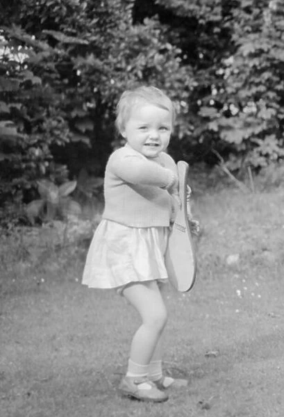 Young girl holding paddle 25th May 1955