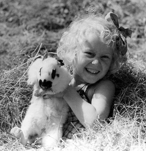 Young girl with pet rabbit Circa 1945 P044458