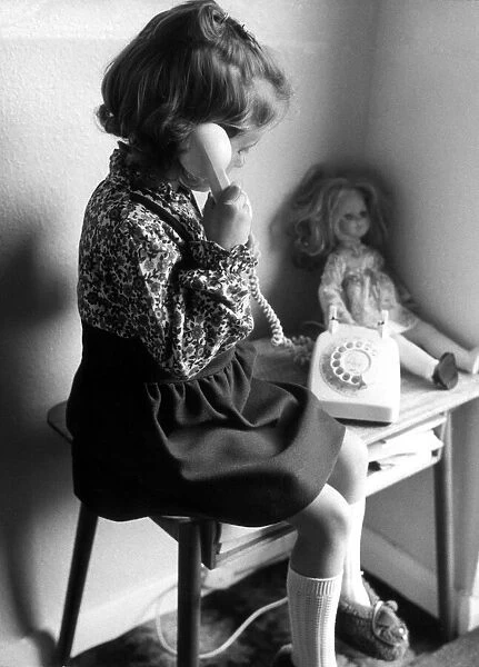 A young girl on the phone. 19th November 1974