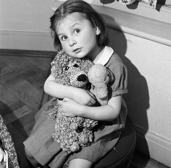 A young girl with her teddy bears. 2nd May 1955