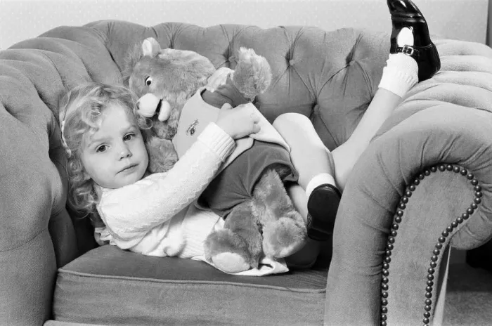 Framed Print : A young girl with a Teddy Ruxpin toy. 21st October 1986