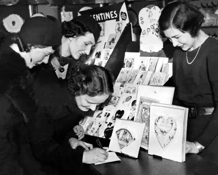 Framed Print : Three young ladies decide which cards to choose for their loved one on St Valentine