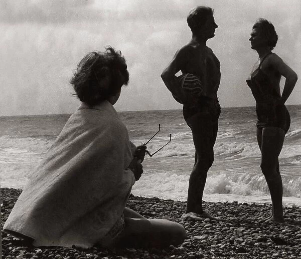 Young people enjoying the evening on the beach July 1953