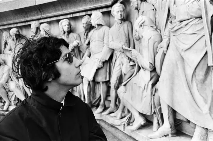 Framed Print : Young pop stars gathered at the Albert Memorial in London for a bread and water lunch to draw attention to Oxfams Christmas appeal. Pictured, Cat Stevens looking at the frieze encircling the podium of the Albert Memorial. 8th December 1966