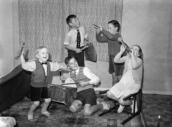 A young skiffle group playing their instruments. Left to right in front, Leslie Bennett