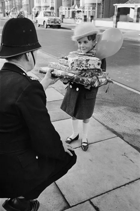 Framed Print : Young Susan Burton holding a pile pf Christmas presents Framed Print : Young Susan Burton holding a pile pf Christmas presents