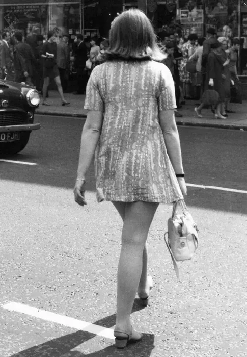 Framed Print : A young wearing a mini-mini dress in height of the swinging sixties