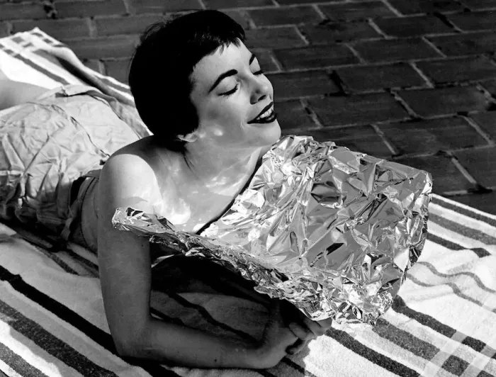 Framed Print : A young woman catching some rays whilst on holidays Sunbathing Framed Print : A young woman catching some rays whilst on holidays Sunbathing