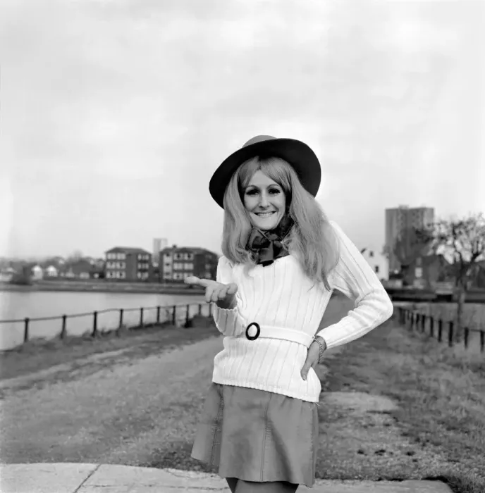 Framed Print : Young woman wearing a hat, mini skirt and knee high boots on the sea front at Southampton Framed Print : Young woman wearing a hat, mini skirt and knee high boots on the sea front at Southampton