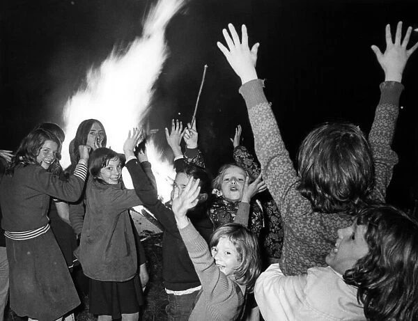 Youngsters enjoying Guy Fawkes Night. 5th November 1975