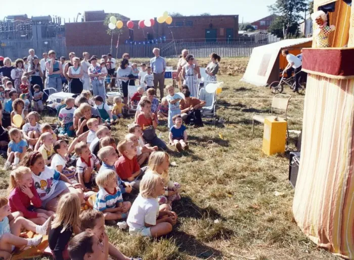 Framed Print : Youngsters are entertained by a Punch and Judy show at Carlin How carnival
